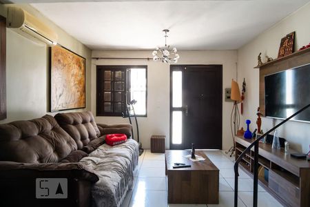 Sala de casa de condomínio à venda com 3 quartos, 104m² em Coronel Aparicio Borges, Porto Alegre