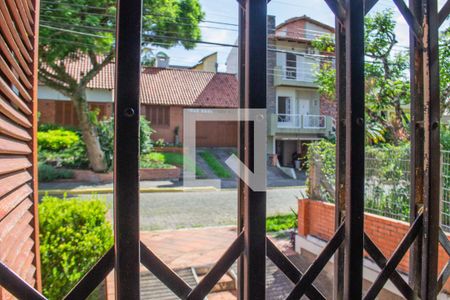 Vista da sala de casa de condomínio à venda com 4 quartos, 371m² em Espírito Santo, Porto Alegre